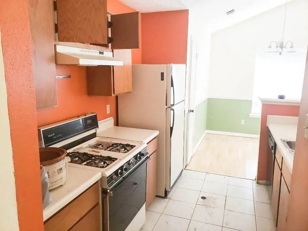 Kitchen — Worn laminate, dated cabinets